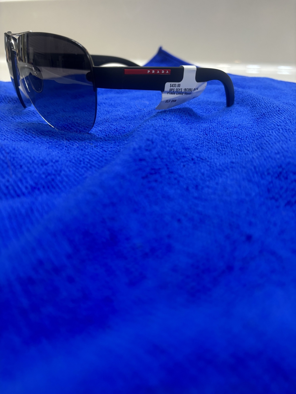 Prada Black Frame Sunglasses with Dark Gray Lenses